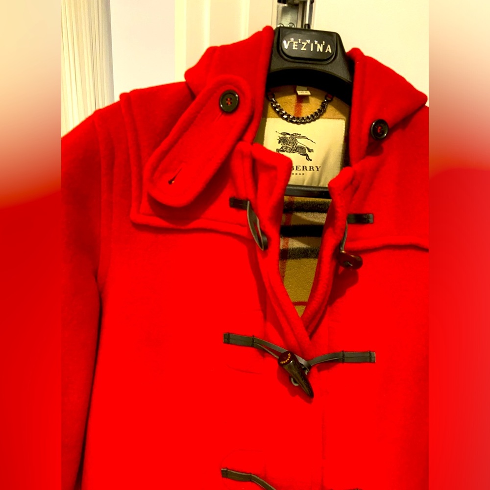 Red Burberry hooded parka. Designed for a relax fit .Brand new condition